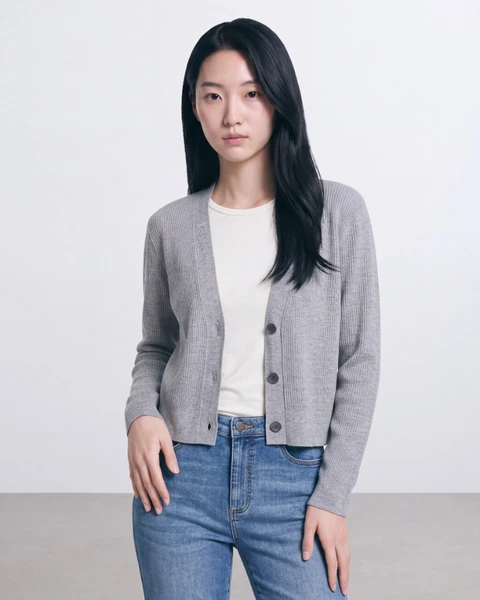 On-model product photo: grey ribbed cardigan, mid crop, hand on hip