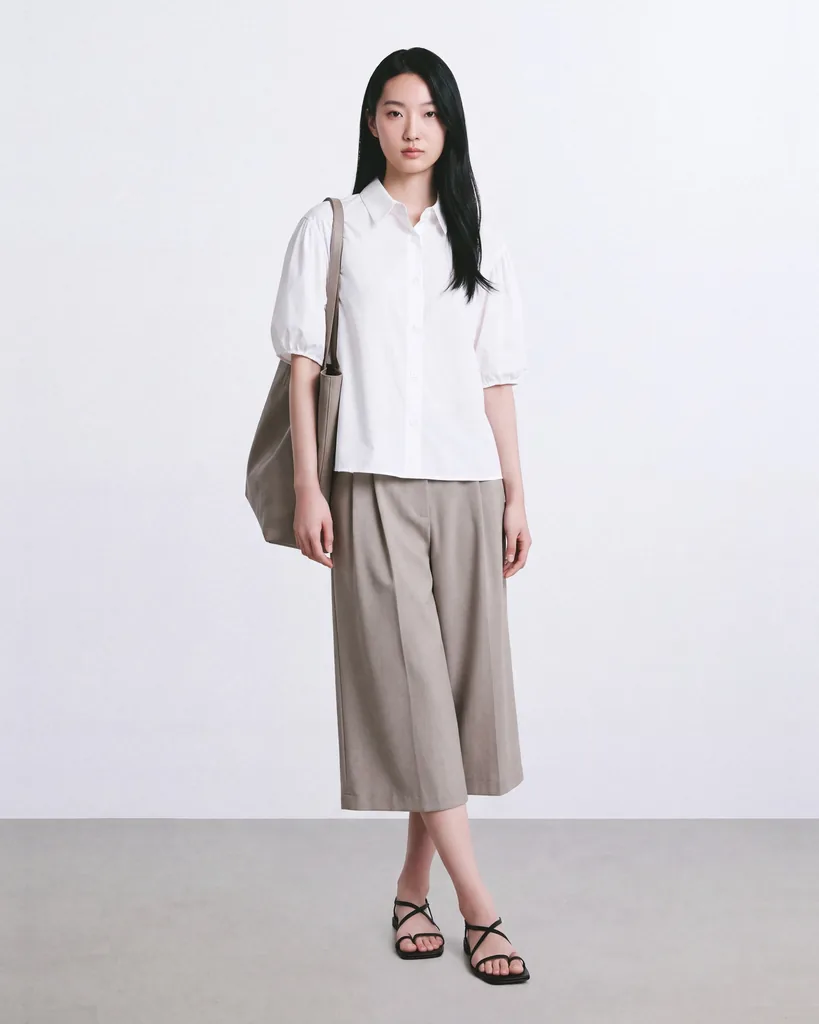 On-model photo of the same taupe shorts set longer than their original length