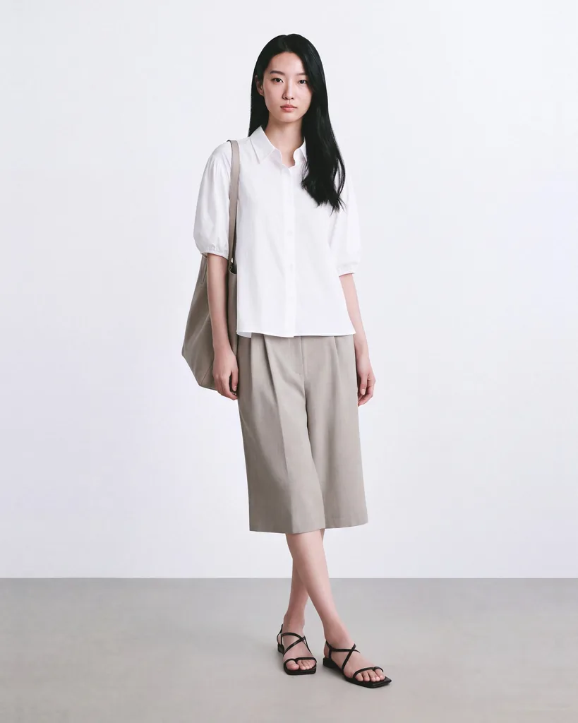 On-model photo of the same taupe shorts at their original length