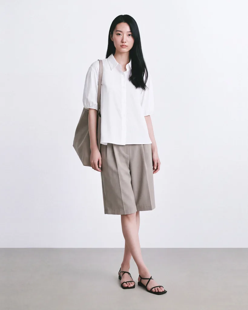 On-model photo of taupe shorts set shorter than their original length
